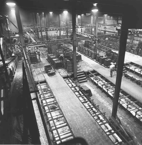 A Black And White Photo Inside Of Badger Foundry