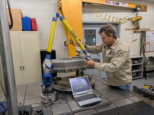 Badger Foundry Employee Working In The Metrology Department