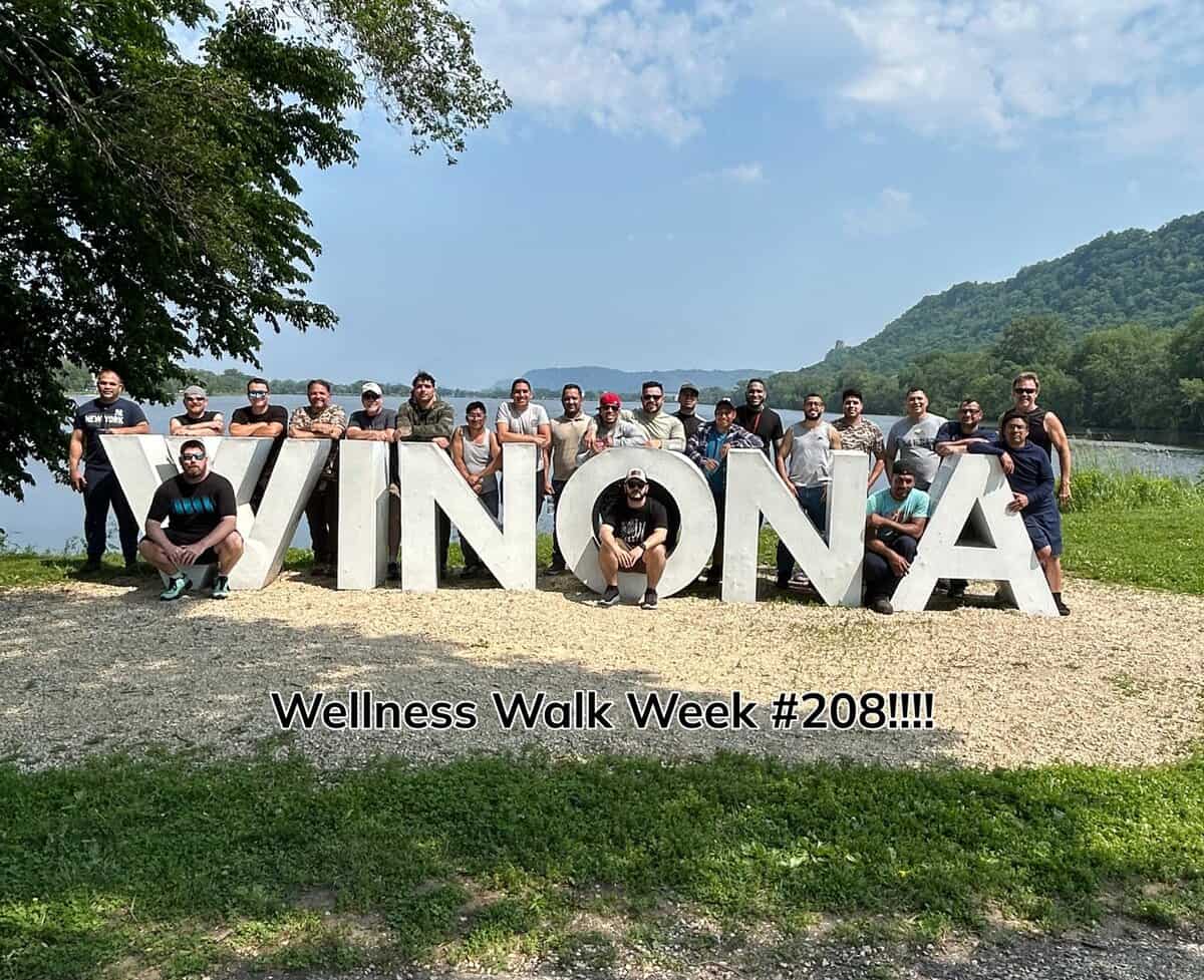 Badger Foundry Wellness Walk Week 208 Group Photograph At The Winona Sign By The Lake