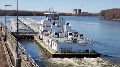 Barge Moving Through The Mississippi River